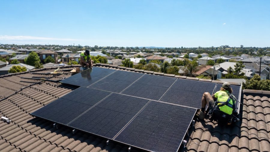 Jinko Tiger Neo solar panels being installed on an Australian suburban home roof